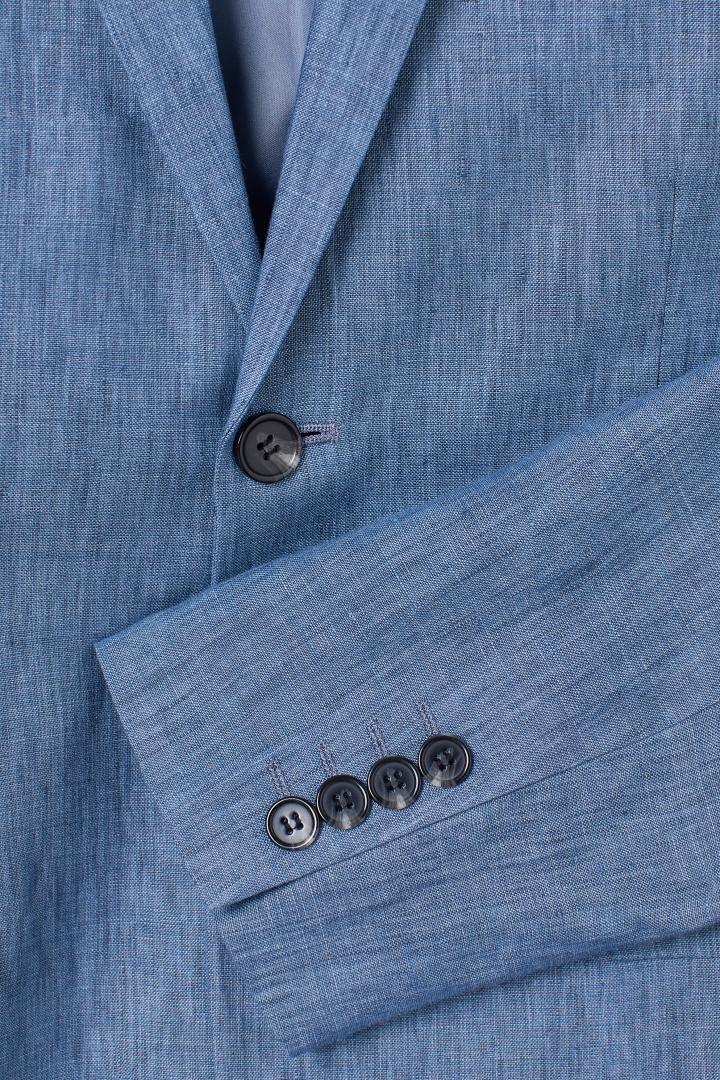 Title: The Artful Etiquette of Button Plating in a Western Suit
