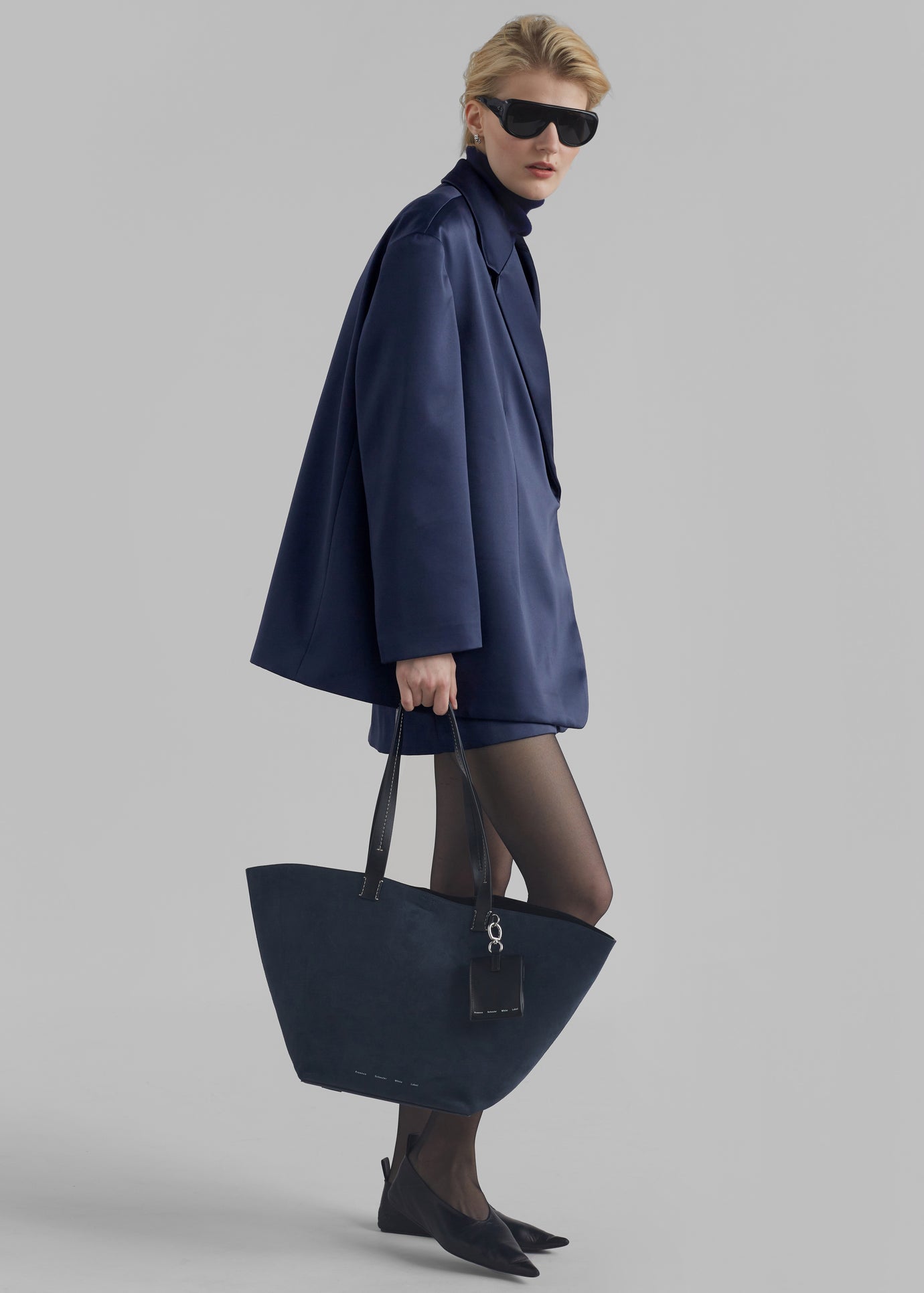 Title: A Symphony of navy blue blazers and the elegance they exude