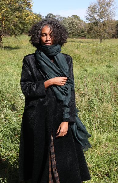 The Elegance of a Black Coat and Scarf