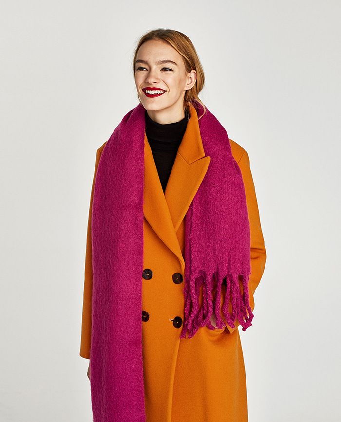 The beauty of a caramel-colored down jacket paired with a scarf