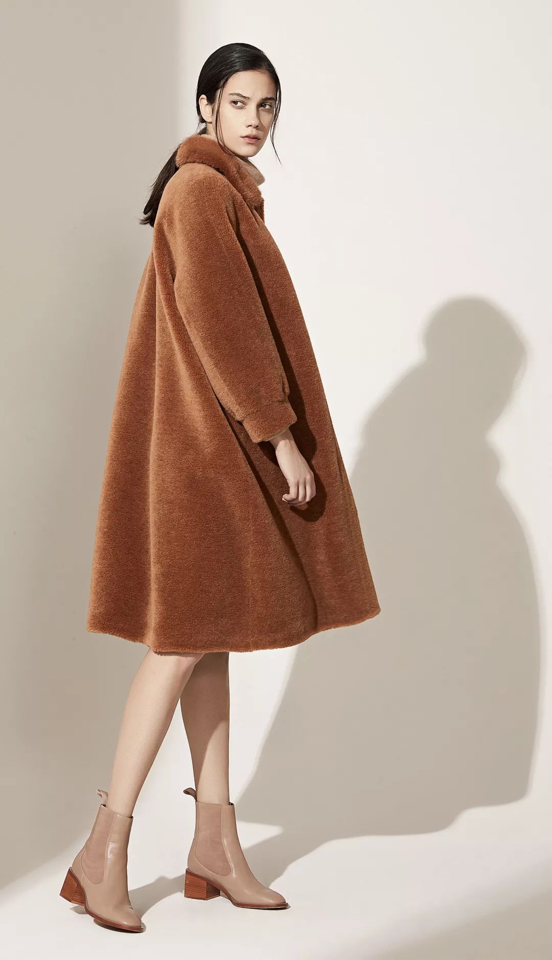 The beauty of a camel coat paired with a scarf